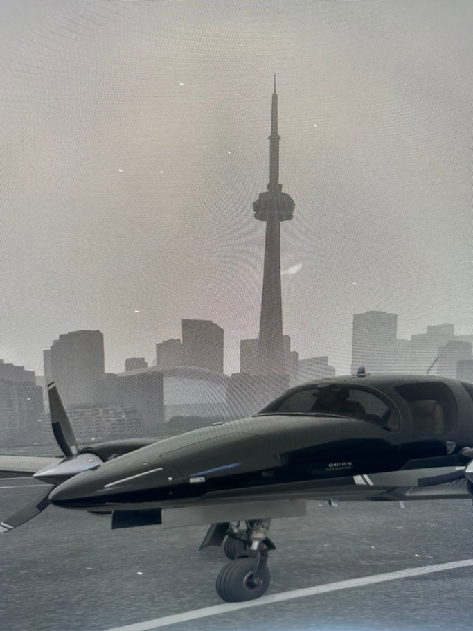 Propeller aircraft on the runway with Toronto's CN Tower behind it